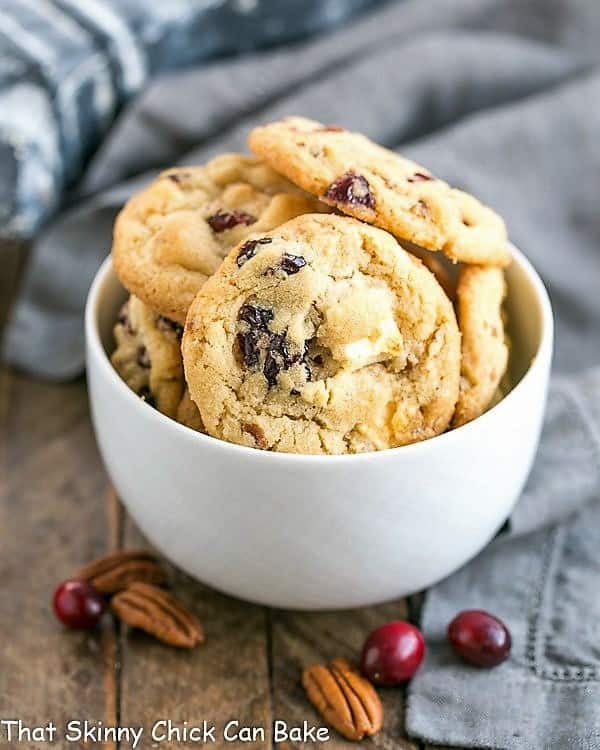 Cranberry, White Chocolate, Crystallized Ginger Cookies - A star studded cookie that's perfect for the holidays and all year long! Cranberry, White Chocolate, Crystallized Ginger Cookies in a white bowl.