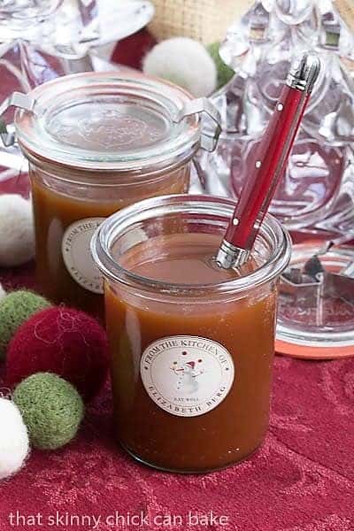 Microwave Caramel Sauce in jars with red handled spoon for serving.