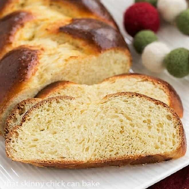 slices of tender Swiss Butter Braid (Butterzopf) on a white platter.