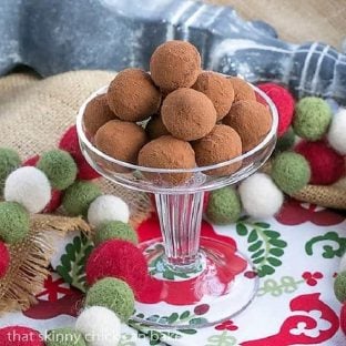 Caramel Filled Chocolate Rum Truffles in a glass candy dish