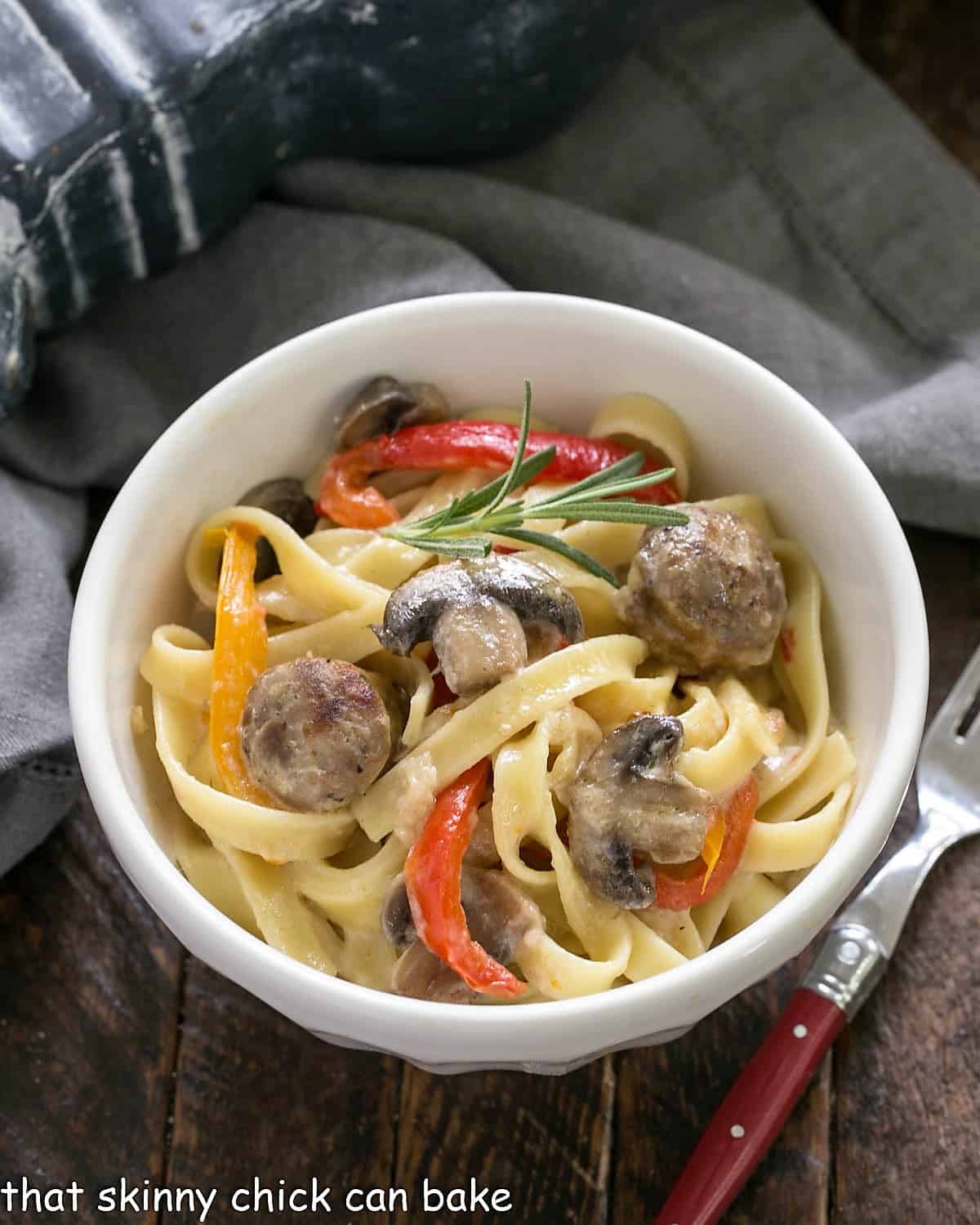 Overhead view of a bowl of Sausage, Pepper, Mushroom Fettuccine.