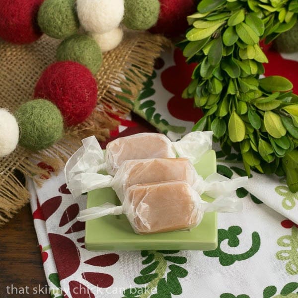 Soft Vanilla Caramels lined up on a small square green plate