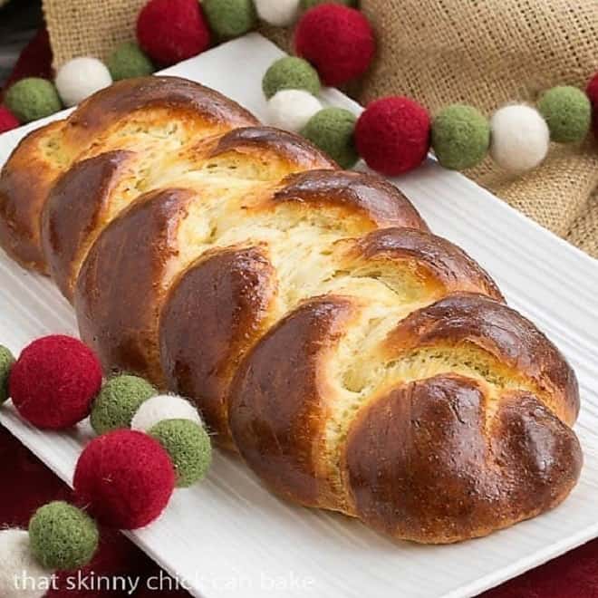 beautiful loaf of Swiss Butter Braid (Butterzopf) on a white platter.