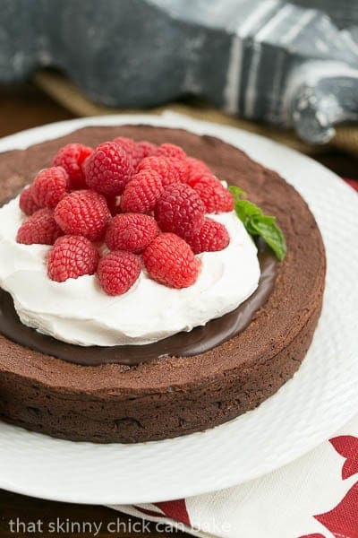 Chocolate Earthquake Cake on a white cake plate with a mint garnish.