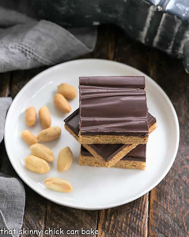 Homemade Reese's Bars on a round white plate viewed from above.