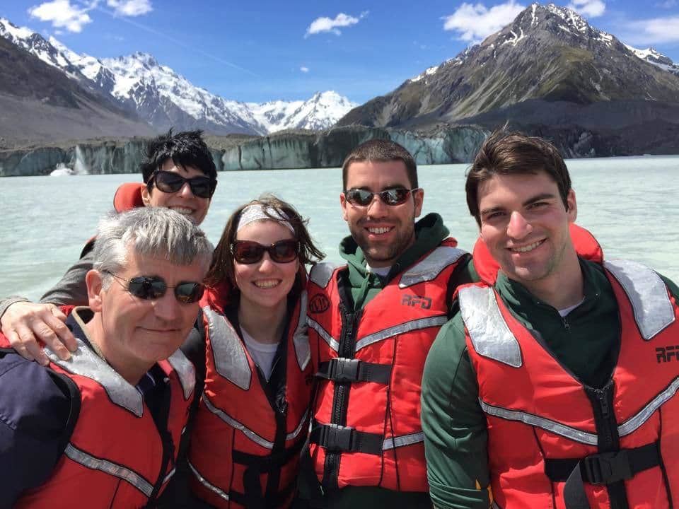 Family on Tasman Lake with Tasman Glacier in the background Family On Tasman Lake