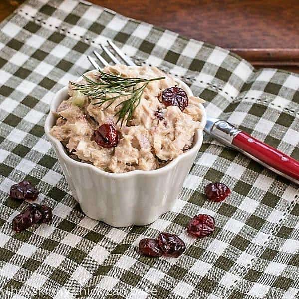 Tuna, Cranberry, Pecan Salad Sandwich in a small white ramekin