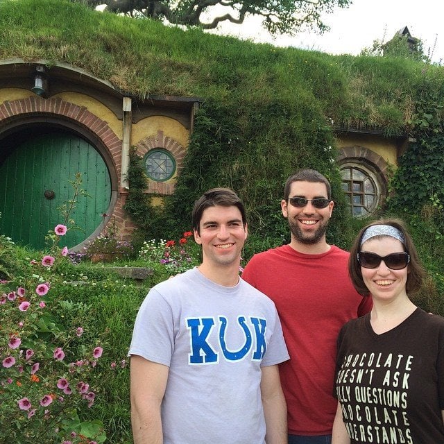 My kids in Hobbiton in front of a Hobbit Hole Kids in Hobbiton