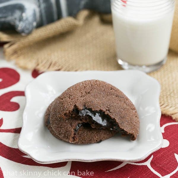 Chocolate Lava Cookies broken in half to expose fudge filling