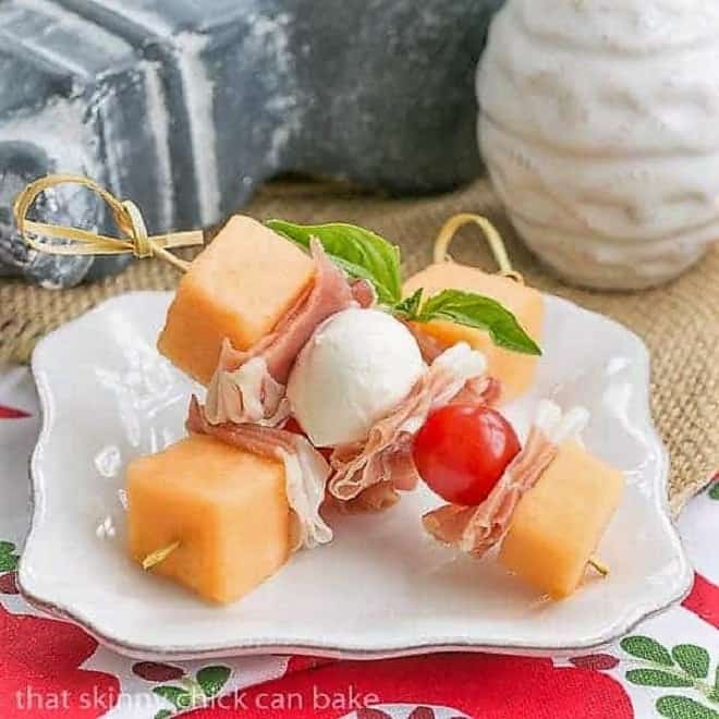 Melon and Prosciutto Skewers on a small white appetizer plate