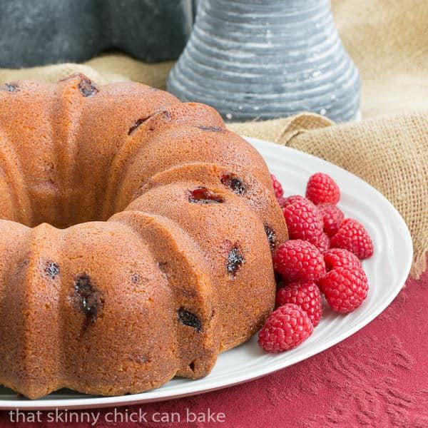 Raspberry Amaretto Bundt Cake | Pound cake full of fresh raspberries and flavored with extracts and liqueur.