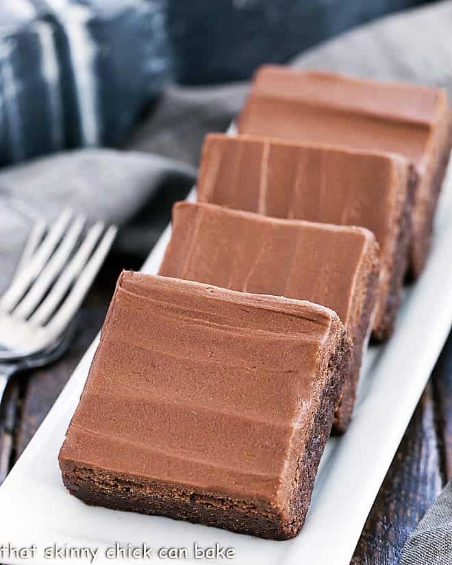 Frosted Brownies on a white tray