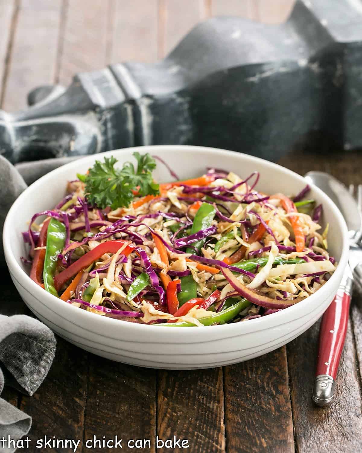 Asian Coleslaw in a white serving bowl.