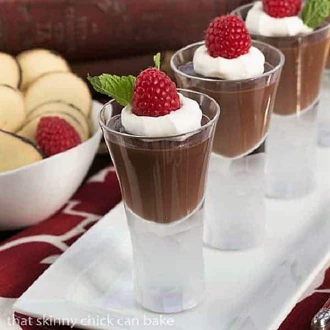 Rich Double Chocolate Pudding in shot glasses on a white tray.