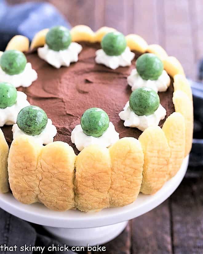 Irish Mousse Cake on a white ceramic cake stand.