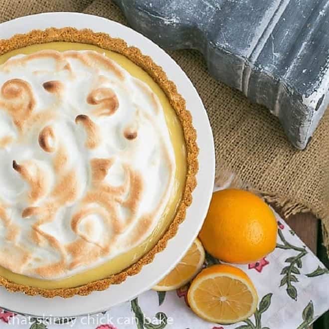 Meyer Lemon Tart with Meringue Topping on a white cake stand from above