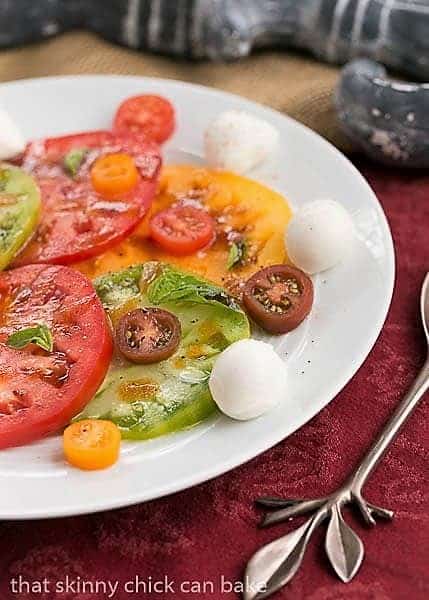 Salade de Tomates et Fromage on a white ceramic plate