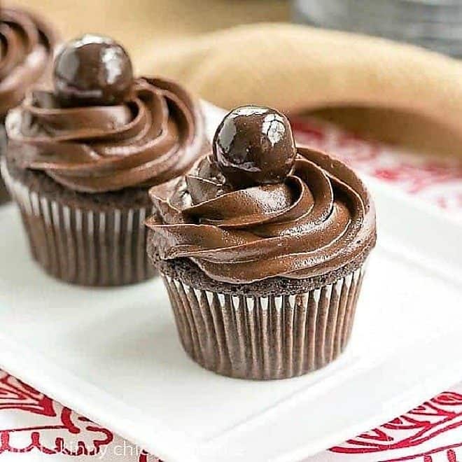 Perfect Chocolate Cupcakes lined up on a white tray