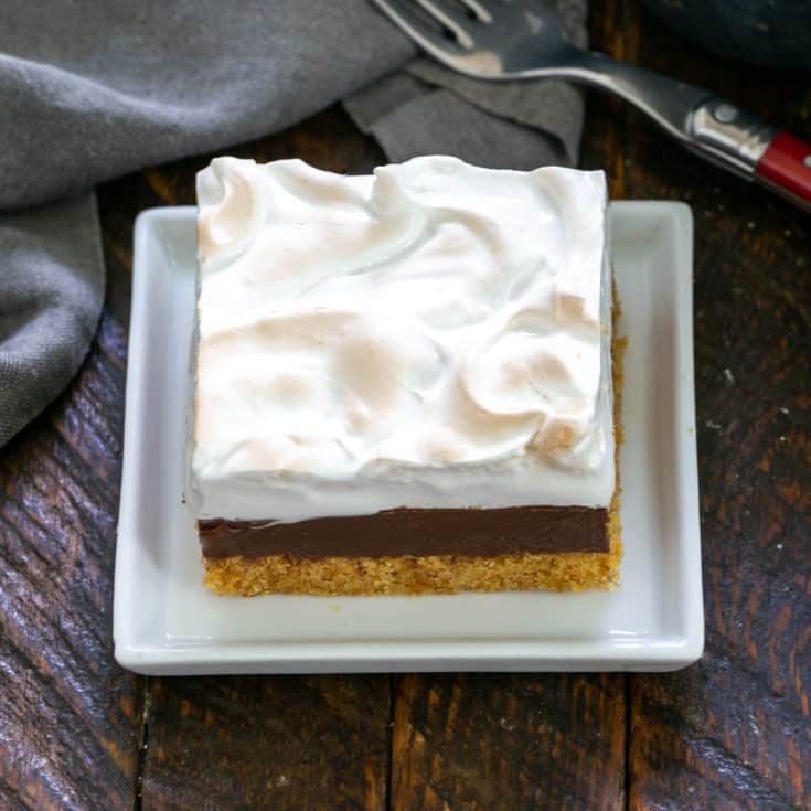 One S'mores Fudg Bar on a square white plate.