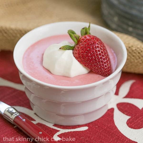 Strawberry Moussein a white ramekin on a red and white napkin.