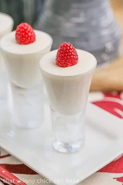 Vanilla Bean Cheesecake Shooters on a white ceramic tray