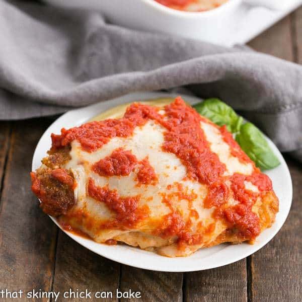 Chicken Parmesan A terrific weeknight dinner of breaded chicken topped with cheese and marinara