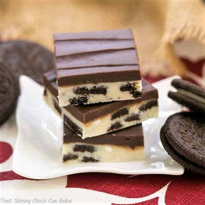 A stack of Oreo Double Decker Fudge on a white ceramic plate