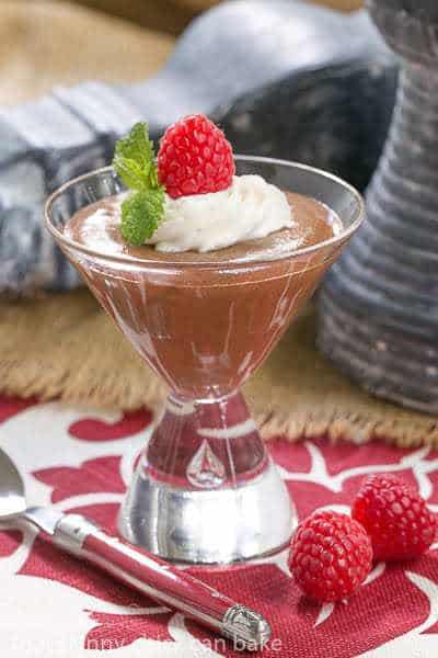 Top Secret Chocolate Mousse garnished with cream, a raspberry and mint