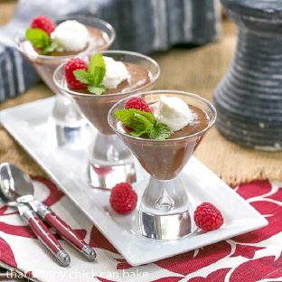 Chocolate mousse in martini glasses on a white tray