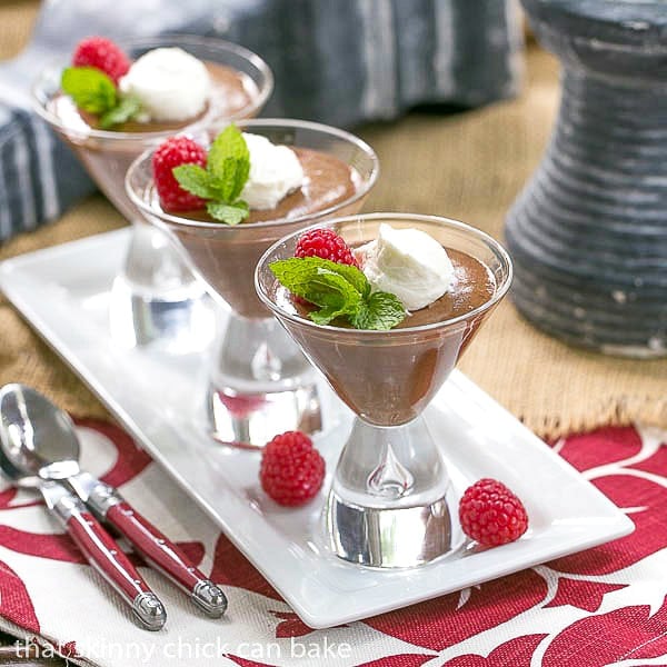 Top Secret Chocolate Mousse in martini glasses on a white ceramic tray.