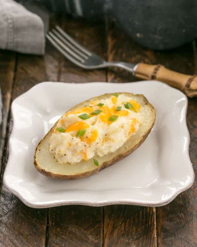 Twice baked potato on a square white plate