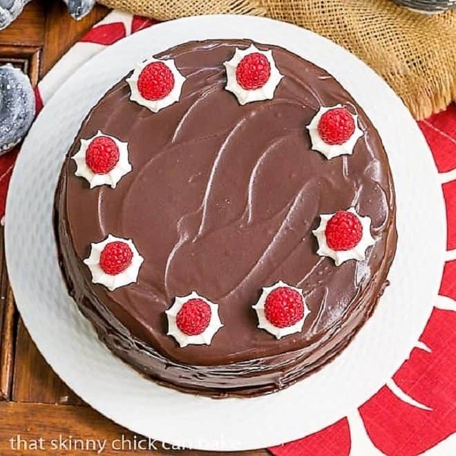 Cheesecake Filled Chocolate Cake on a white plate viewed from above