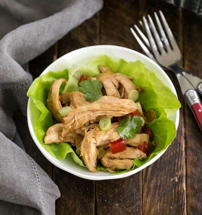 Shredded Chicken Lettuce Wraps in a white bowl with two forks