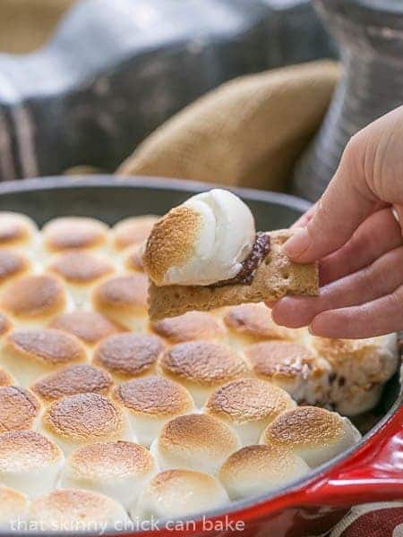 Skillet S'mores Dip - Chocolate ganache topped with roasted marshmallow with graham cracker dippers