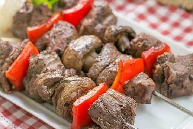 Tender Beef Steak Kabobs on a white plate