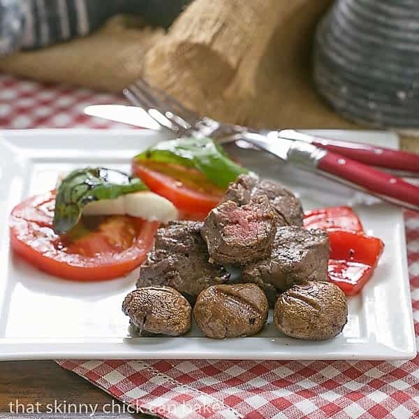 Tender Beef Steak Kabobs on a white plate