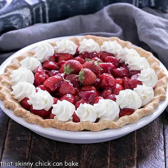 Fresh strawberry pie in a white pie plate