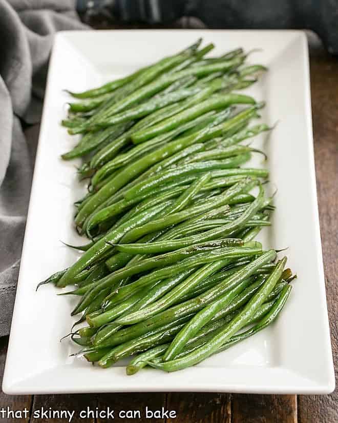 Asian Green Beans Recipe on a white ceramic platter.