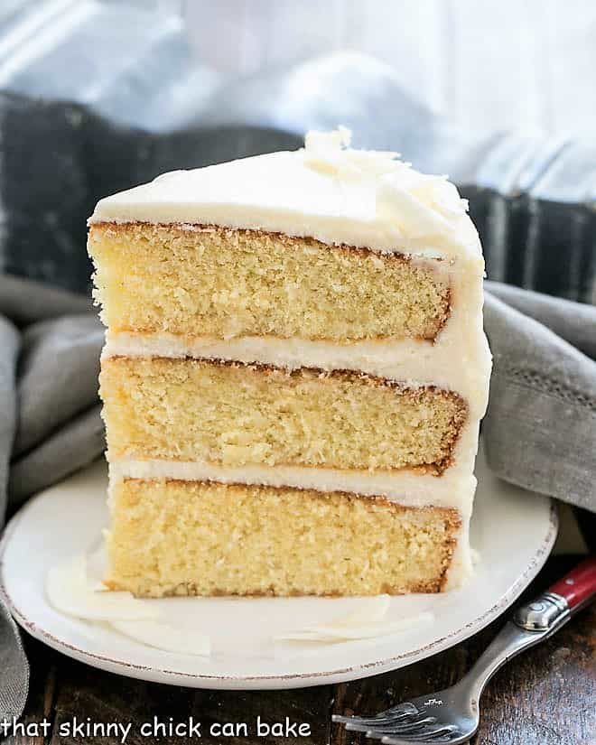 Italian Cream Cake slice on a white dessert plate.