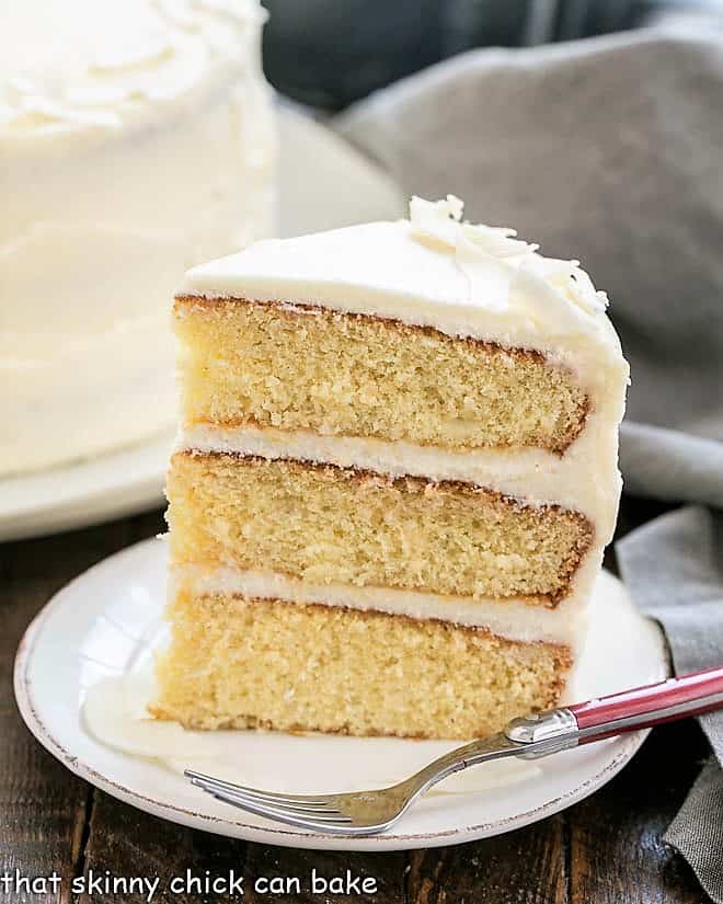 Italian Cream Cake slice on a white dessert plate.