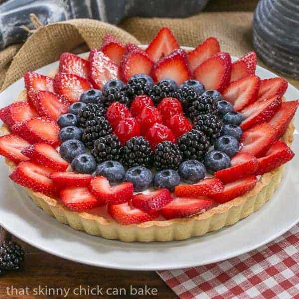 Summer Fruit Tart | Pastry crust with whipped cream and cream cheese filling topped with glorious summer berries