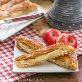 2 slices of a Maple Glazed Apple Tart on a square white plate