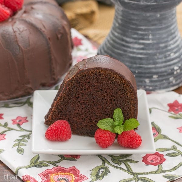 Slice of Chocolate Buttermilk Bundt Cake on a square white dessert plate.