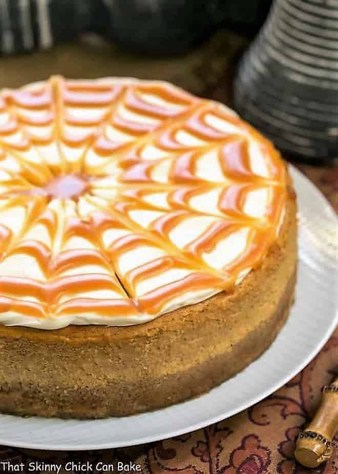 Caramel Topped Pumpkin Cheesecake on a white serving plate.