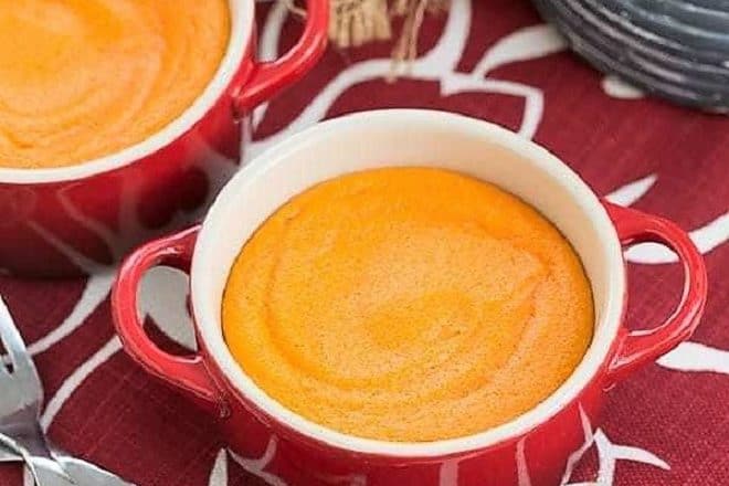 Carrot Puff in two small red baking dishes over a red and white napkin