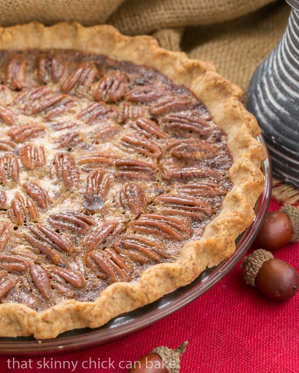 Classic Pecan Pie, spiked with bourbon in a pastry crust on a red napkin.