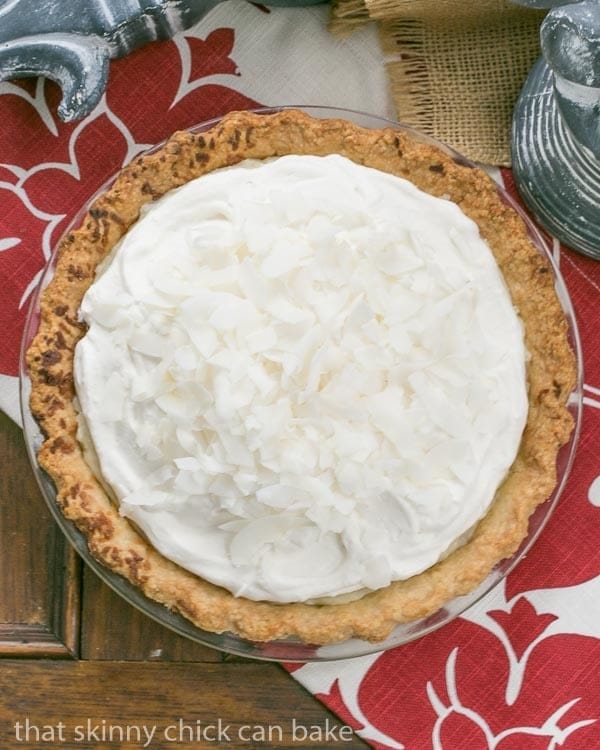 Coconut Cream Pie | Coconut crust filled with creamy coconut laden custard with a decadent whipped cream topping!