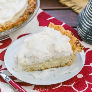 Coconut Cream Pie - Coconut crust filled with creamy coconut laden custard with a decadent whipped cream topping!