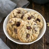 White bowl full of double chocolate oatmeal cookies