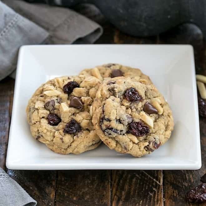 Loaded oatmeal cookies on a square white plate